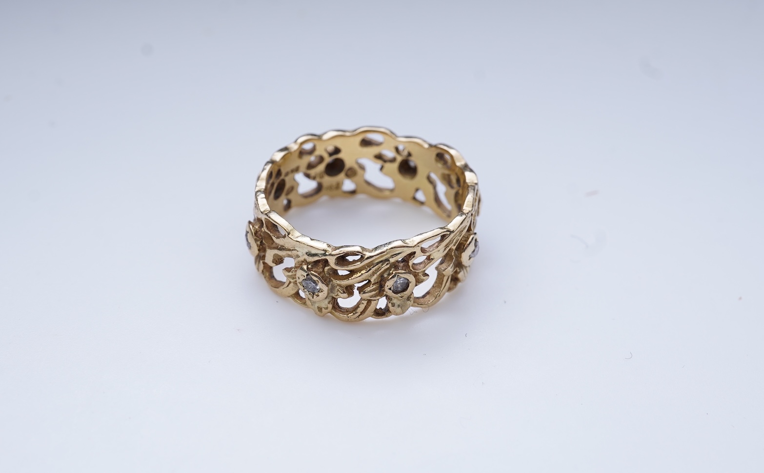 A gold and diamond eternity ring